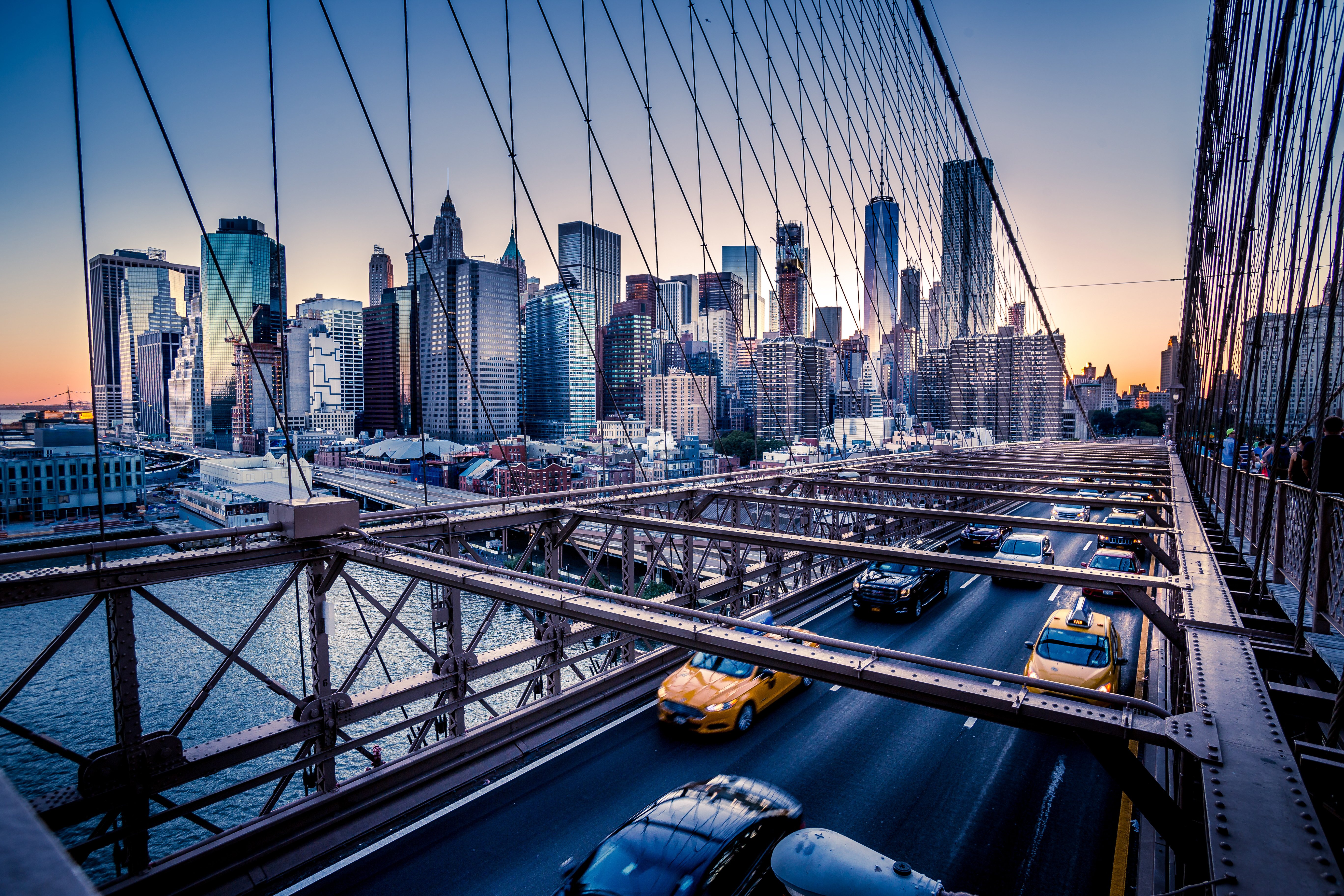 Brooklyn Bridge, Downtown Manhattan, New York. Night scene. Light trails. City lights. Urban living and transportation concept